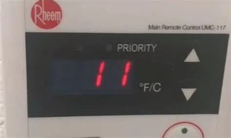 Plumber troubleshooting a tankless water heater — Rheem error code 11 no ignition fix guide